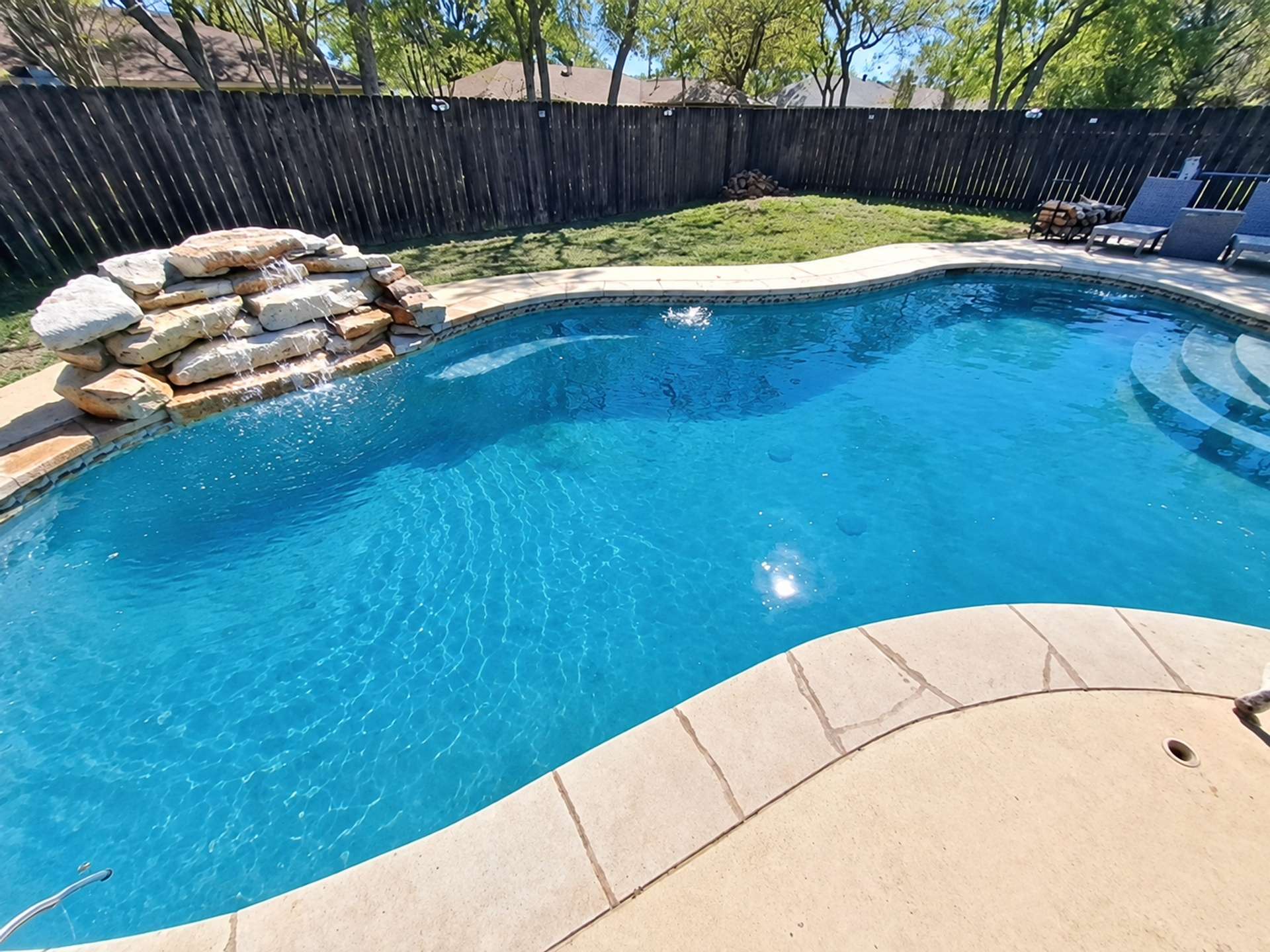 Crystal clear blue pool water after green to clean recovery