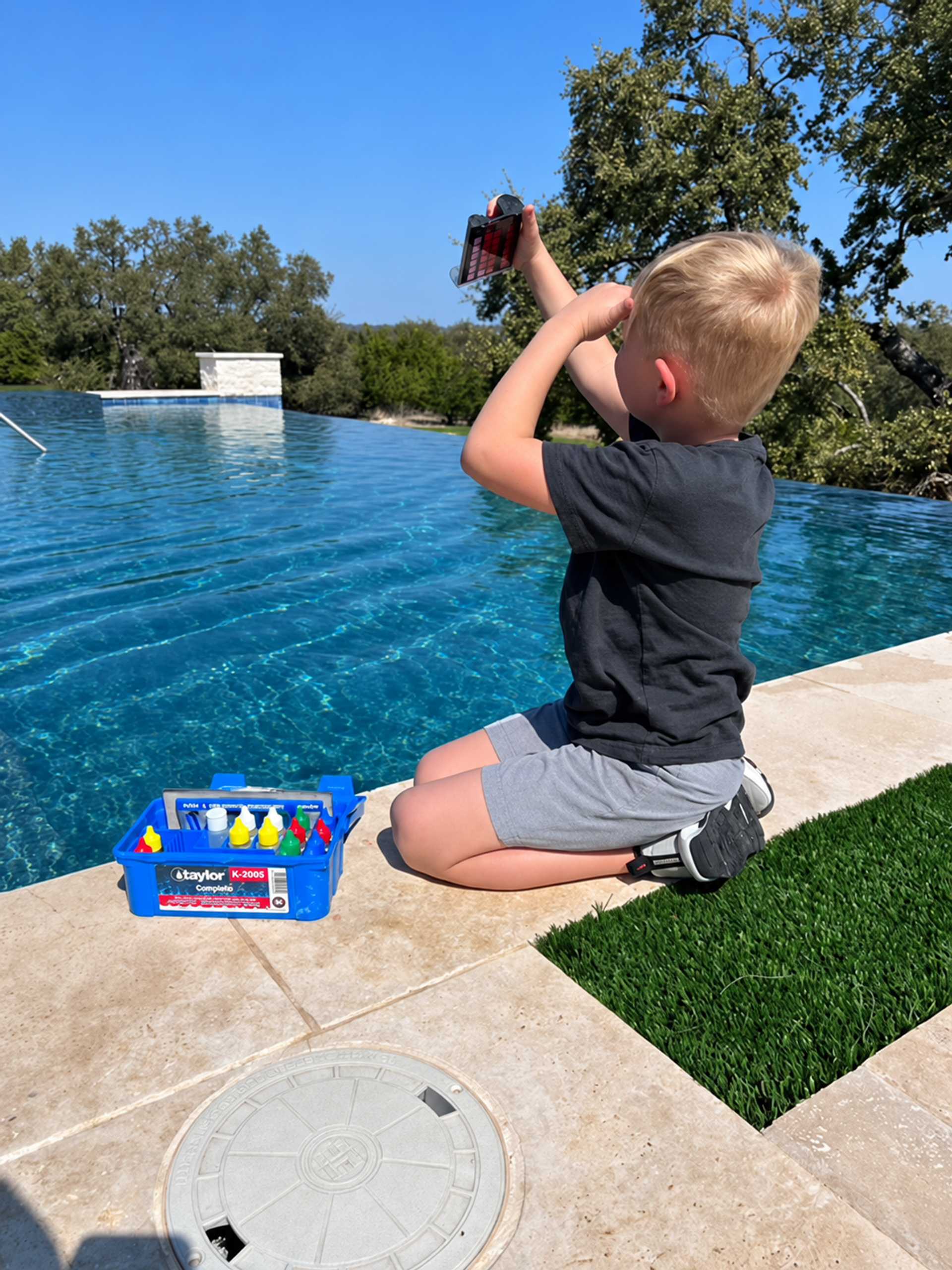 Testing pool water chemistry and balance by the pool in Georgetown Texas