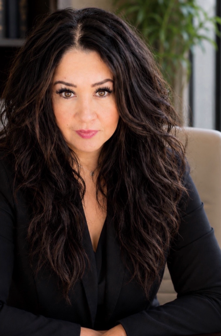 Maria E. De La Garza - President & Founder