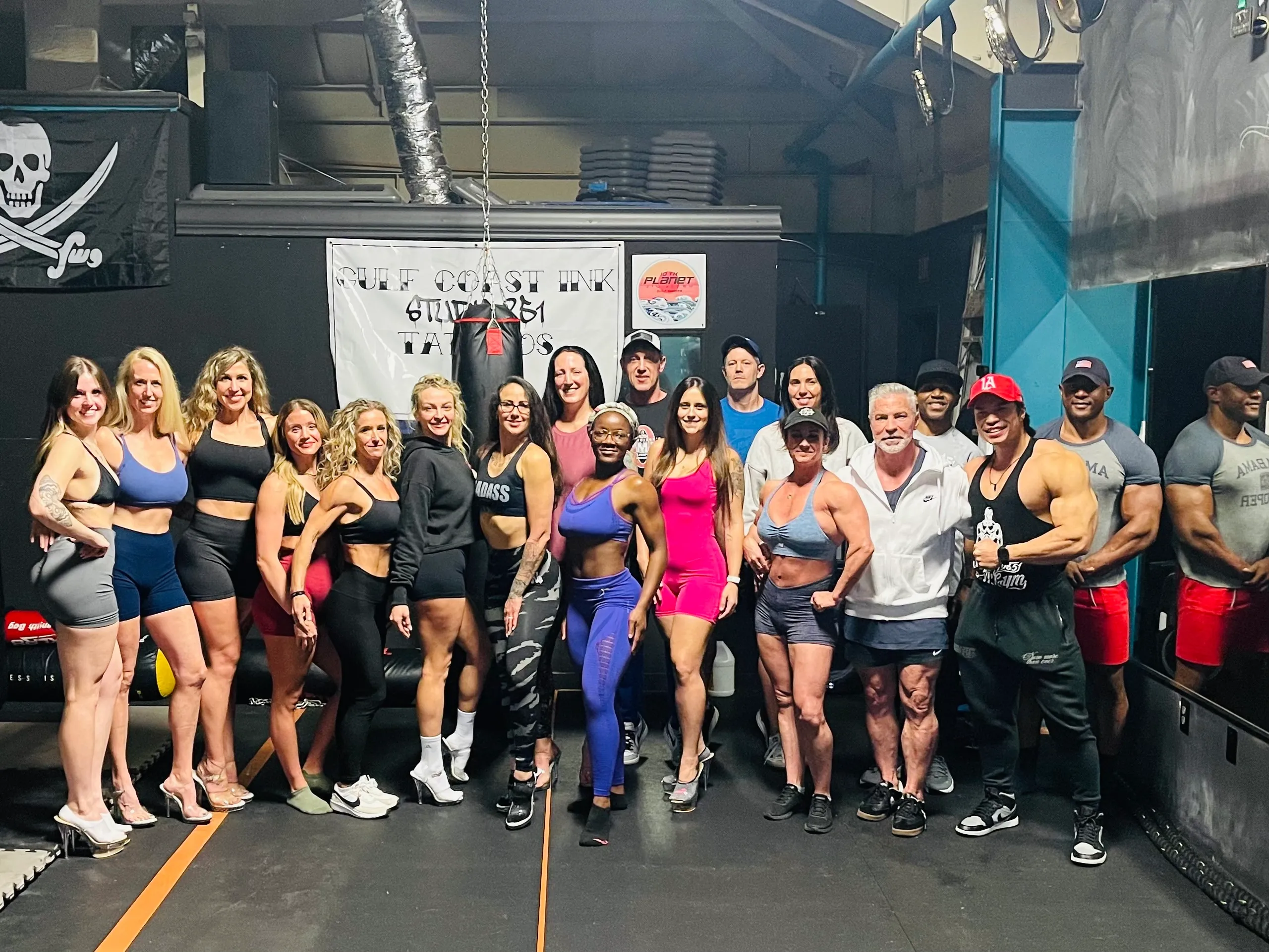 Competitors lineup posing practice at Fitness Factory