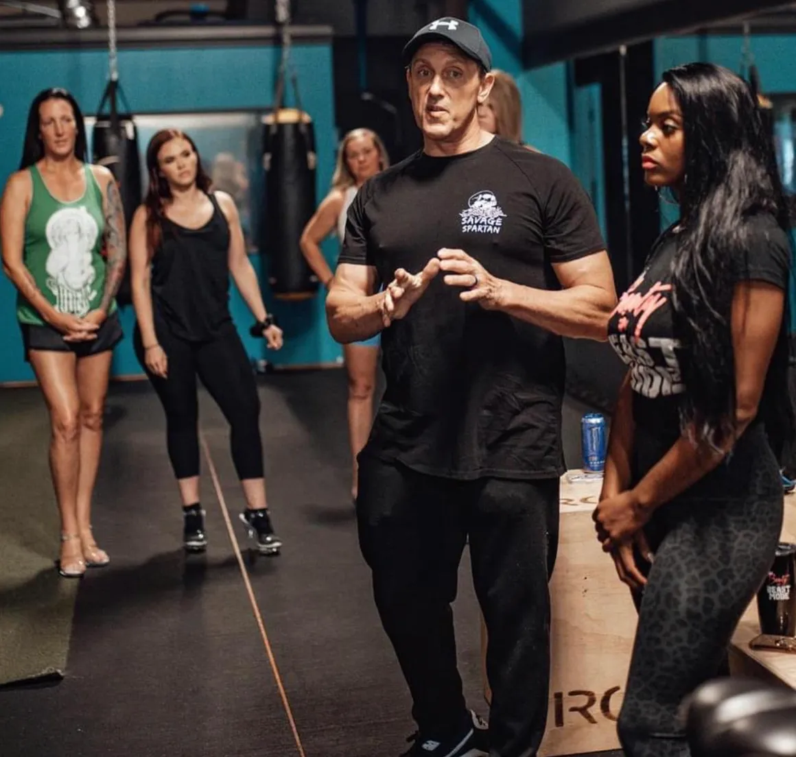 Nate Eaton coaching aspiring competitors at a posing clinic
