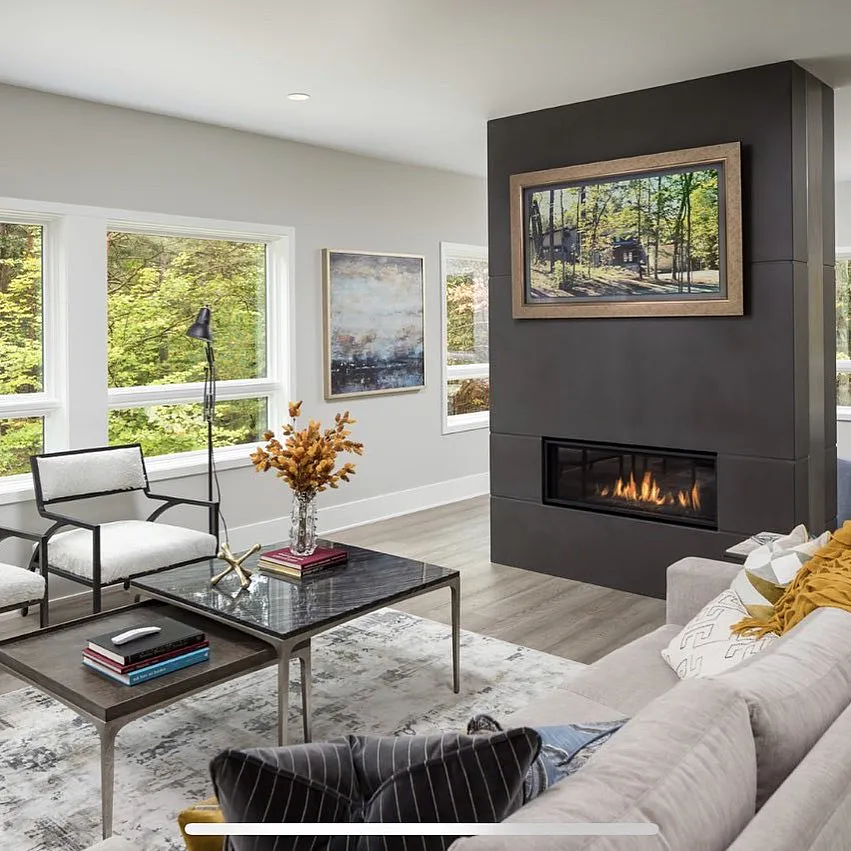 Contemporary Dallas living room with modern linear fireplace in dark charcoal surround featuring a Samsung Frame TV with Deco wood-style moulding showing nature artwork.
