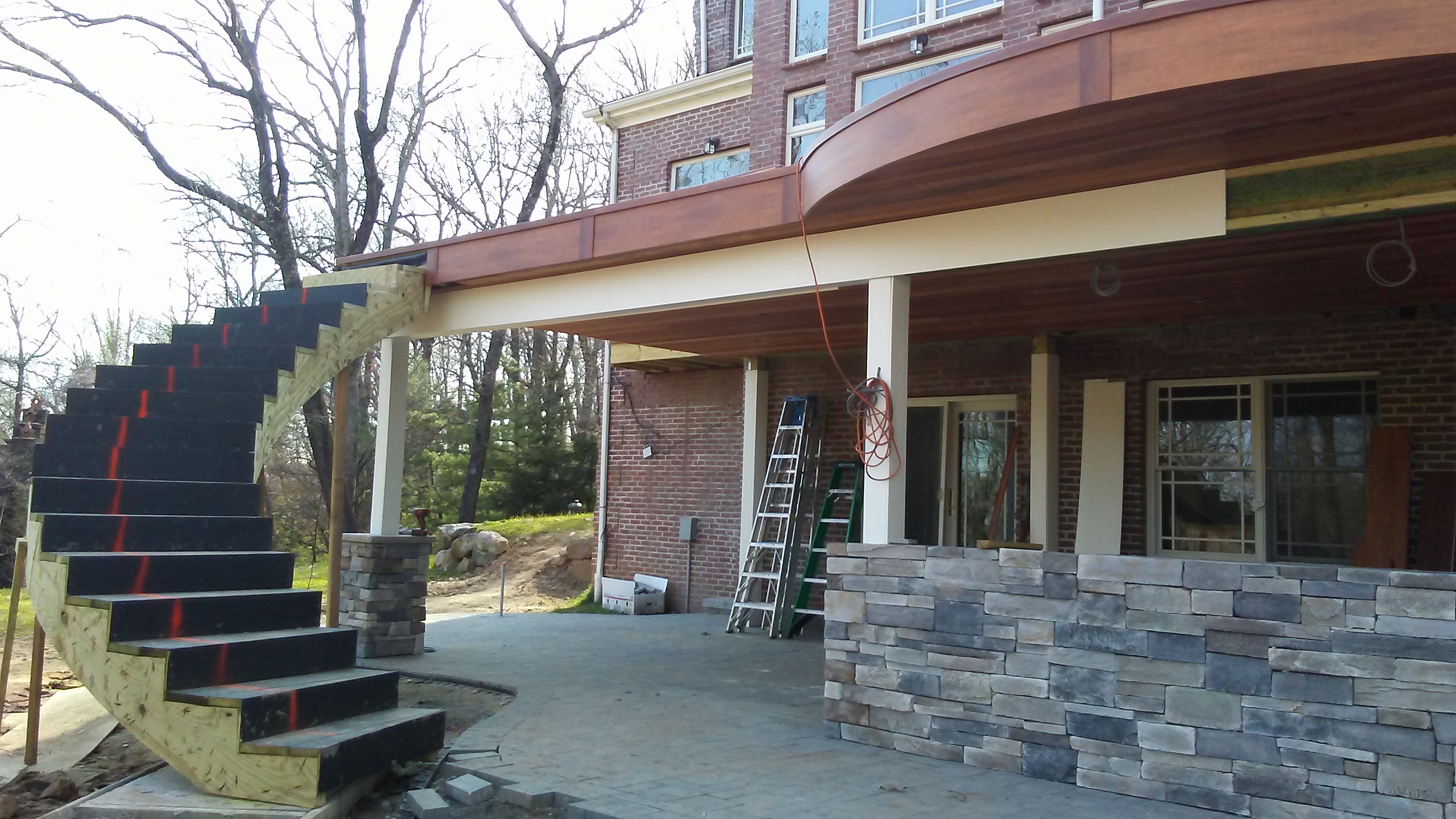 Architectural Curved Helical Staircase & Covered Stone Terrace