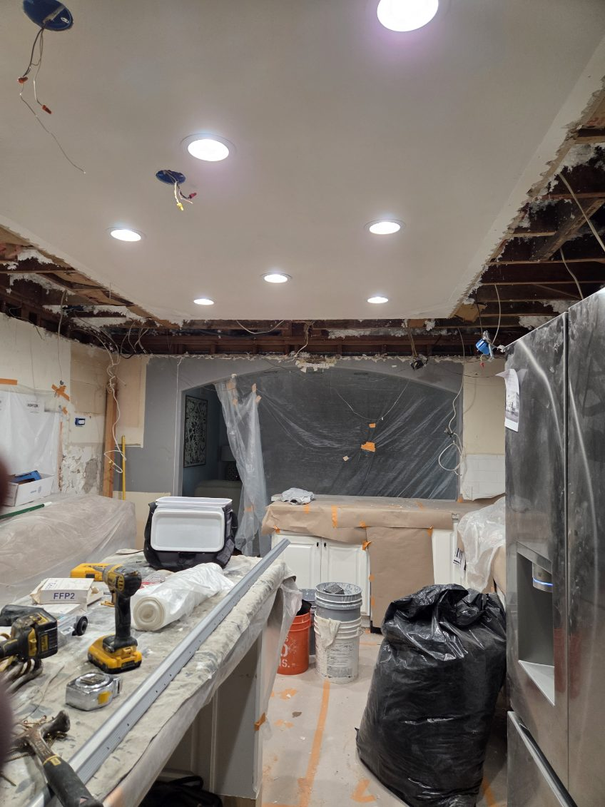 Kitchen recessed lighting installation and ceiling drywall restoration with dust containment