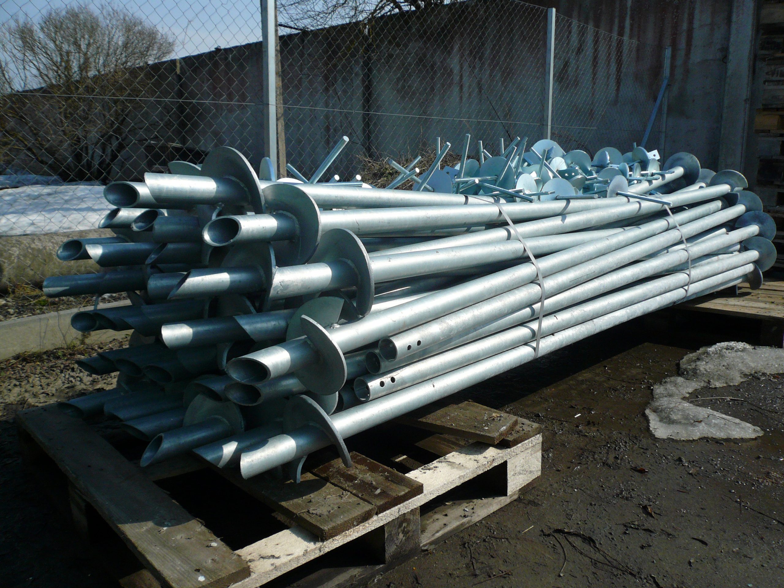 Galvanized helical screw piles ready for installation