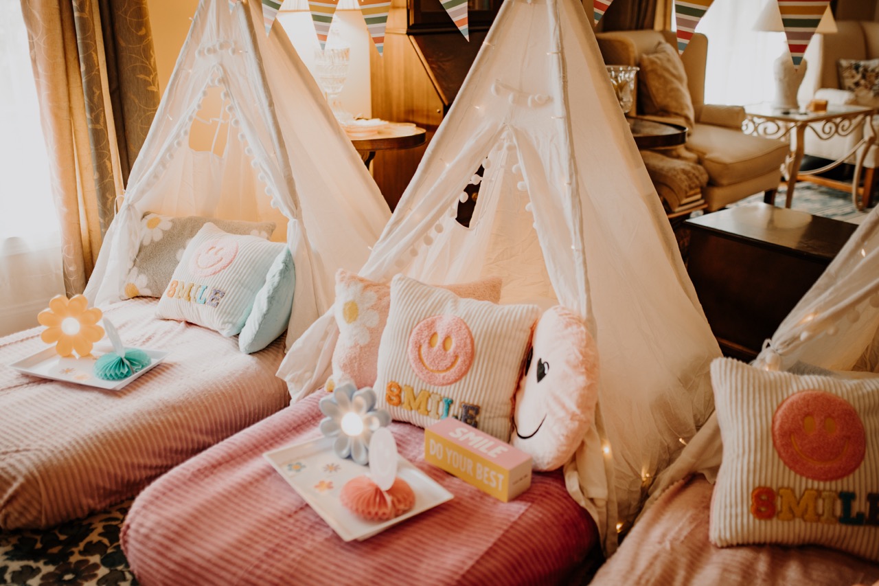 Flower Power teepees with textured corduroy mattresses, SMILE embroidered cushions, and illuminated flower trays