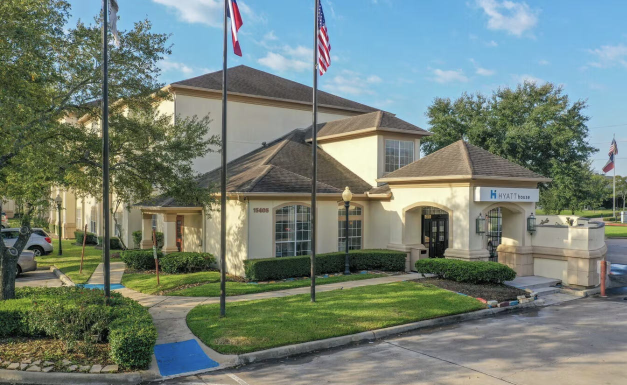 Featured 116-suite Houston-area commercial property — three-story building