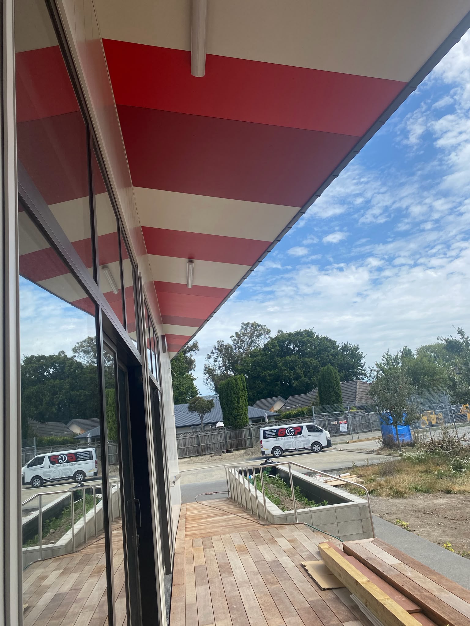 Architectural commercial eaves and soffits assessed on site with Garden City Painters fleet