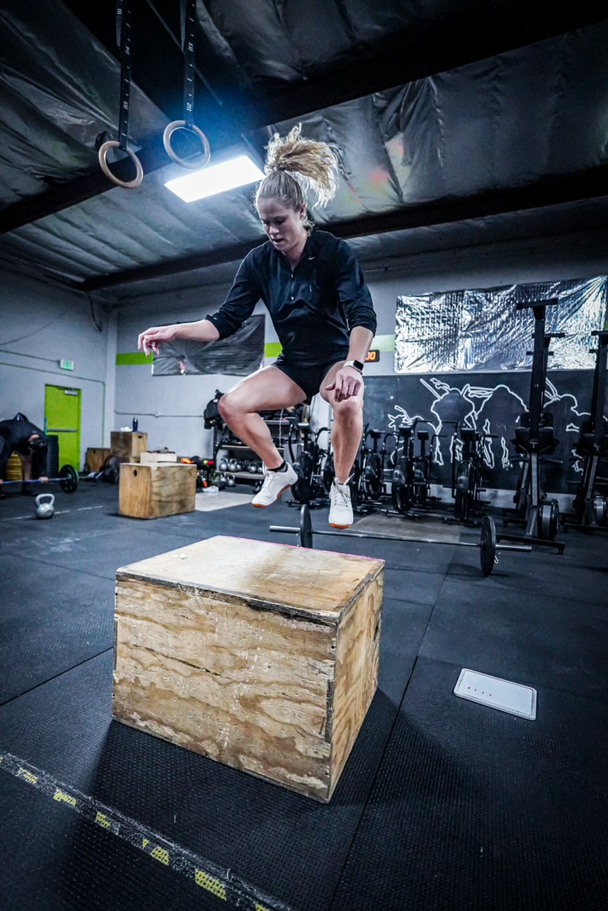 Lauran Orrin exploding into a box jump with peak athletic power
