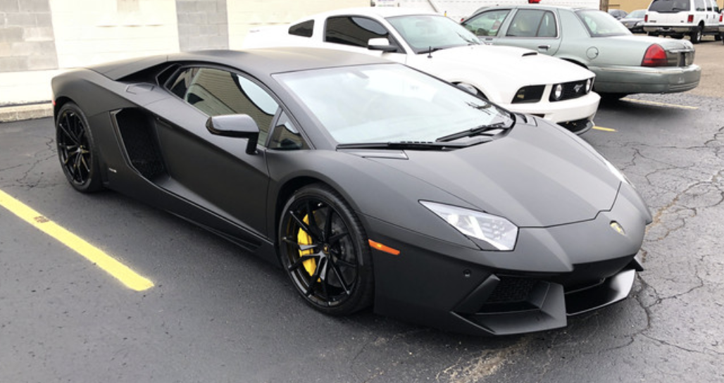 Black Lamborghini Aventador with full-body stealth PPF and wrapped edges at Miami Glow Customs