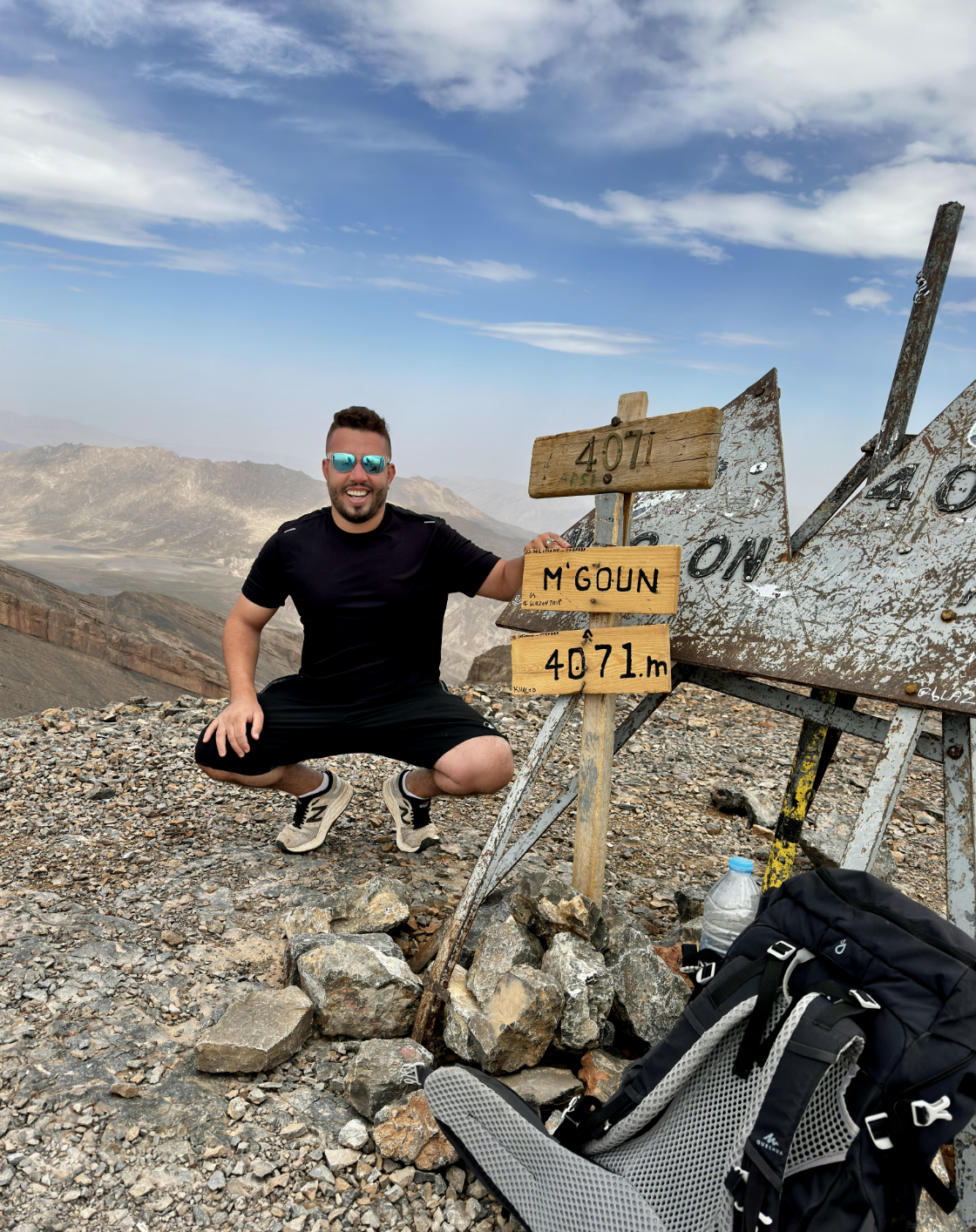 Noureddine, Founder of Morocco Flawless Travel, at the summit of Mount M'Goun (4,071 m) in the Atlas Mountains
