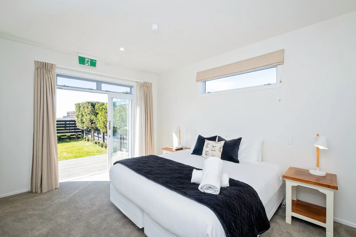 Luxury private king ensuite bedroom opening to garden deck