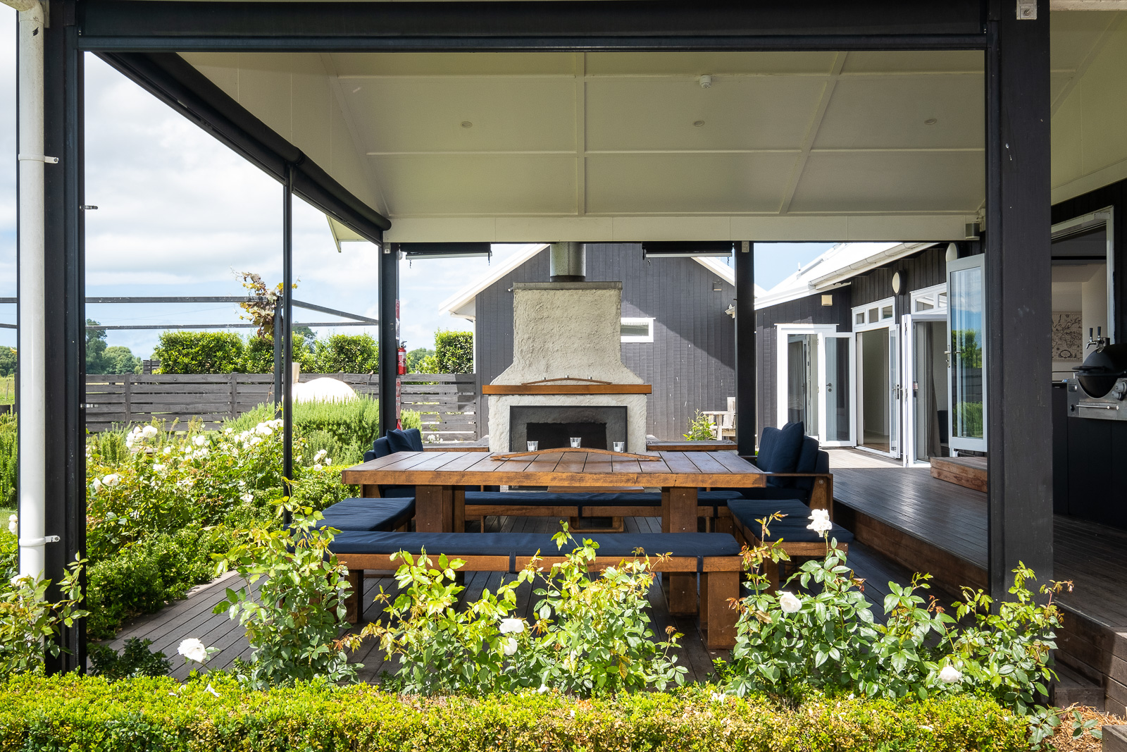 Lawn Road Retreats outdoor entertaining fireplace and covered deck