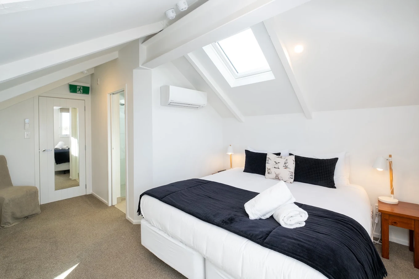 Luxury vaulted bedroom with skylight and private ensuite