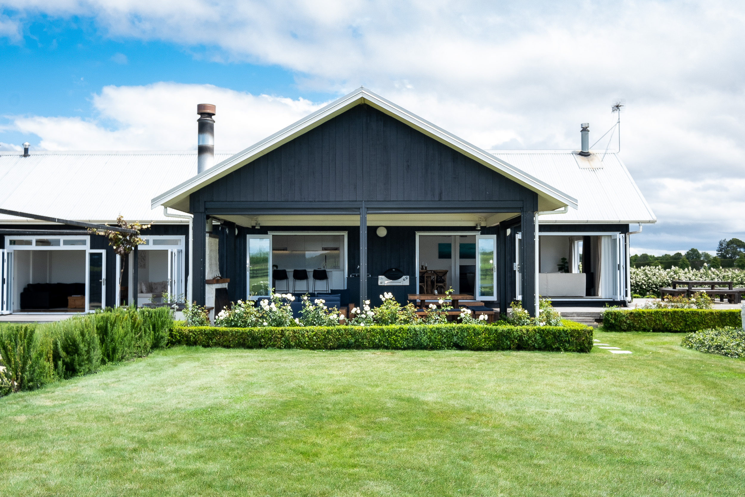 Lawn Road Retreats Hawke's Bay main lodge and expansive manicured lawn