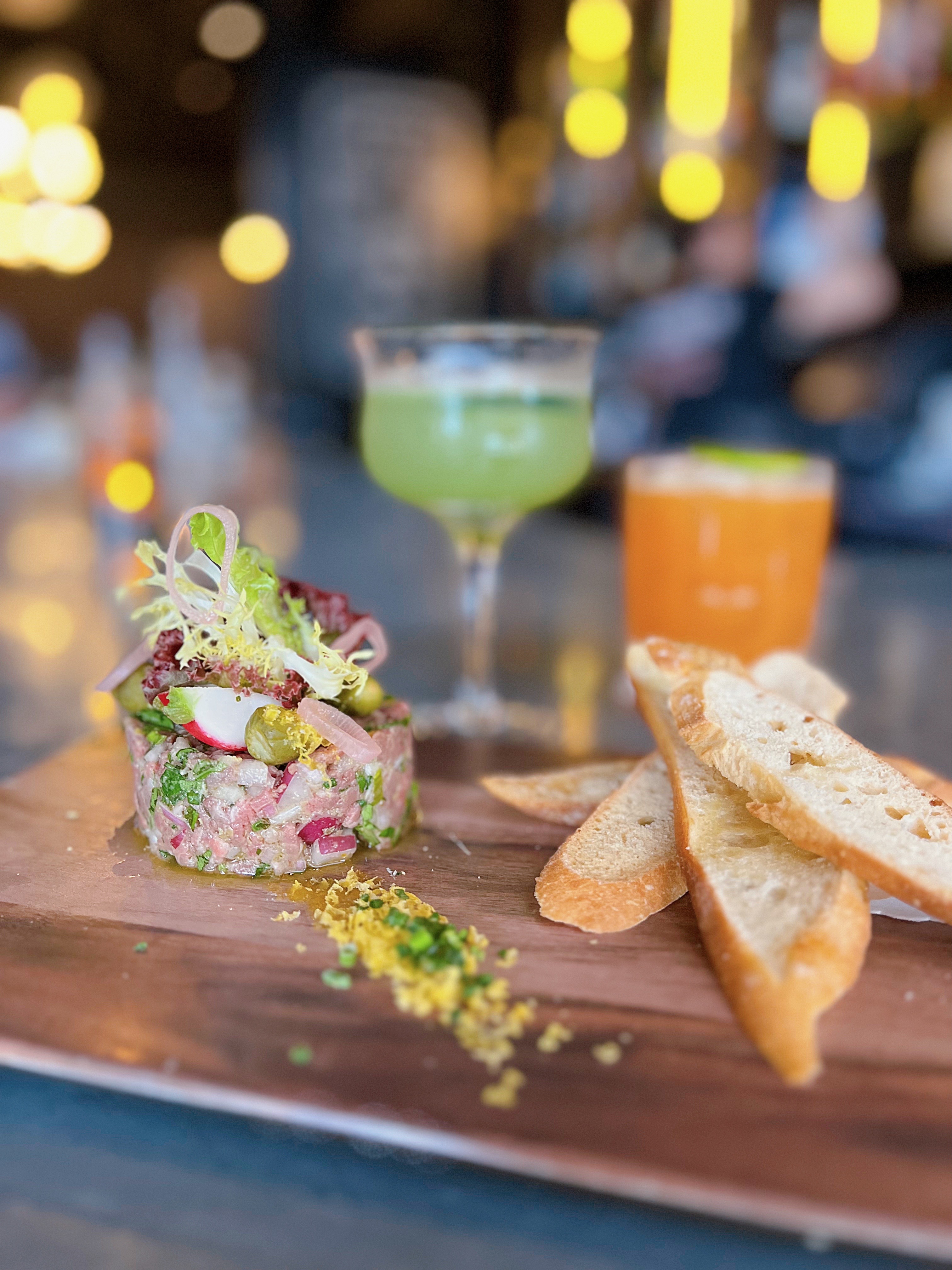 French small plates and tartare served at Et Voilà Happy Hour