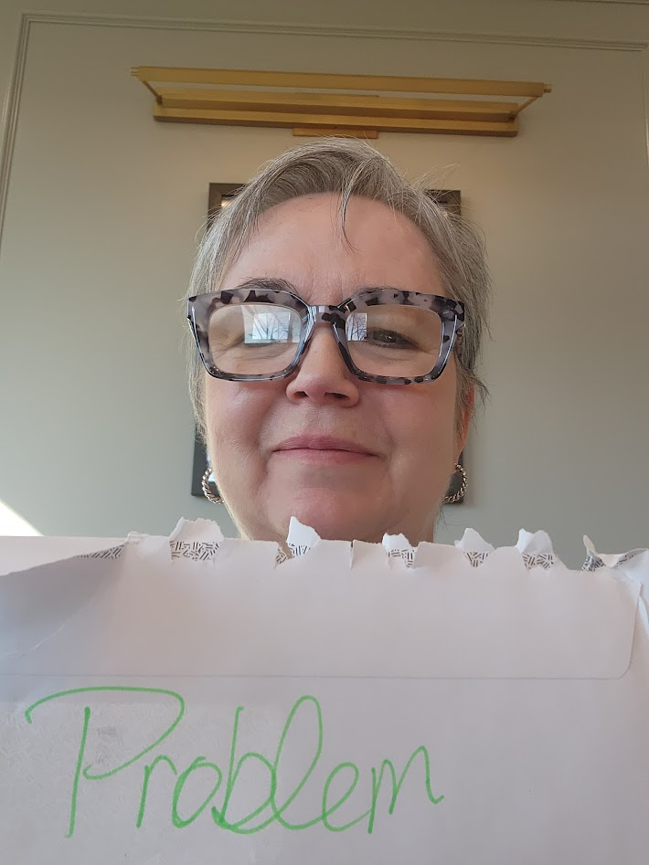 Sherri Bartin holding a handwritten note