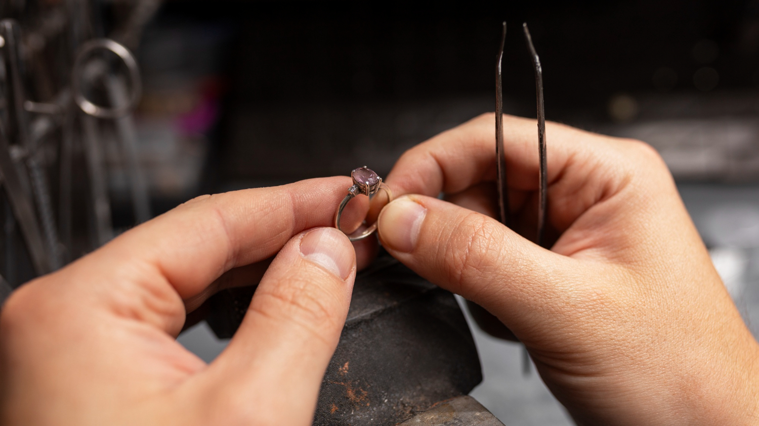 Master jeweler hand-crafting a custom gemstone ring at Wulf Diamond Jewelers