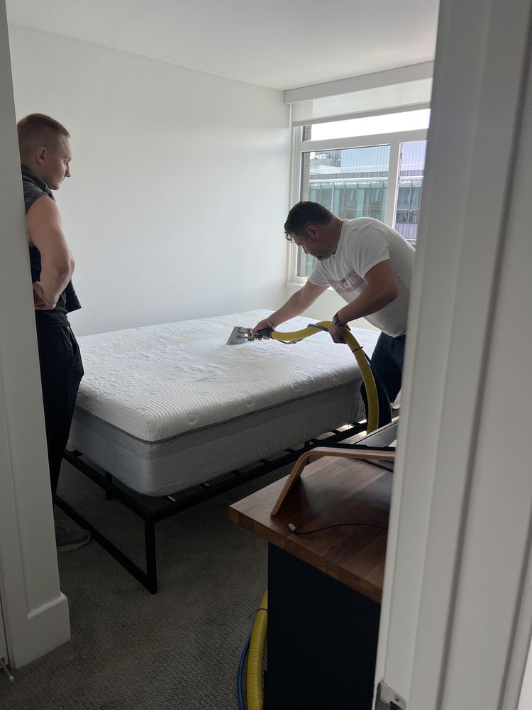 Nice and Clean Carpet Cleaning technician performing professional mattress and upholstery steam cleaning
