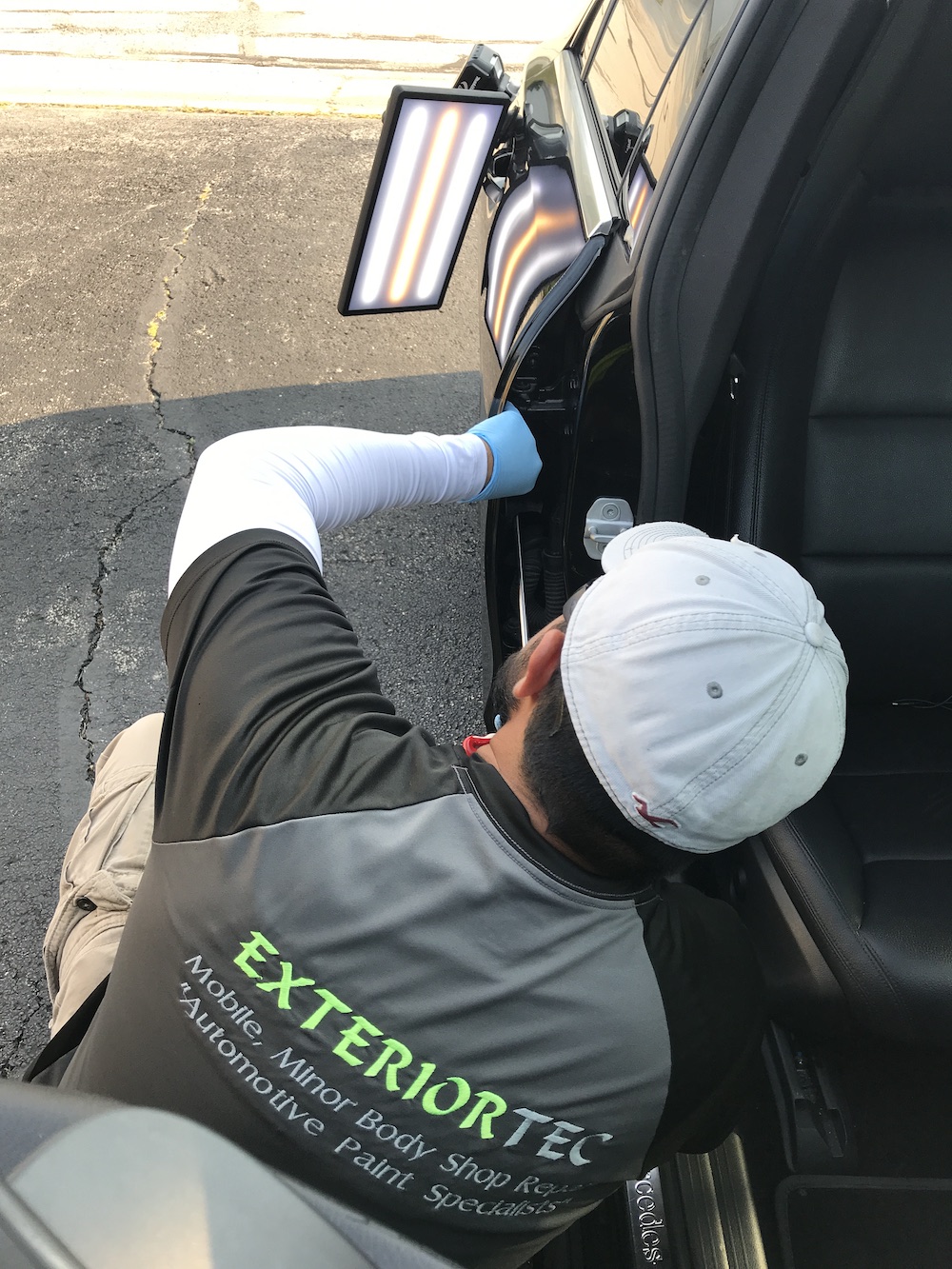 Paul Exteriortec Master Dent Technician Repairing Door Dent On Location