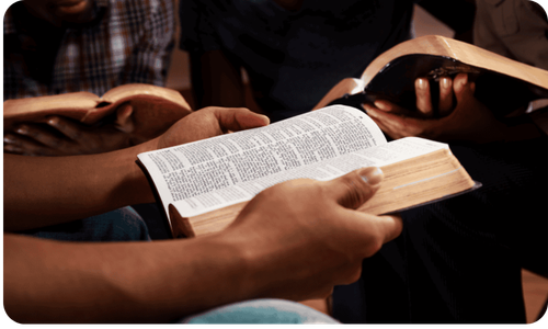 Believers studying an open Bible together
