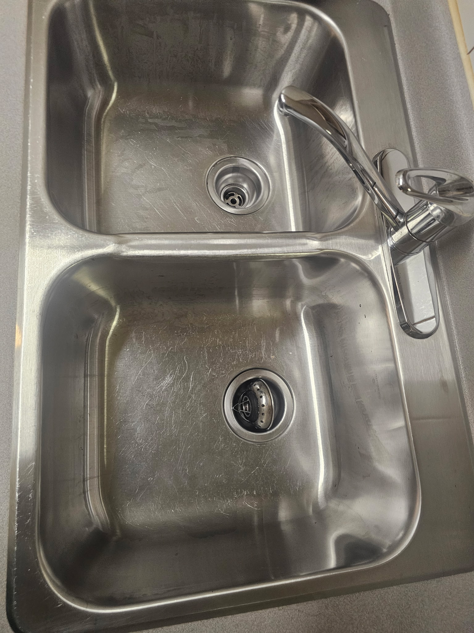 Kitchen sink spotless and sanitized after cleaning in Toronto