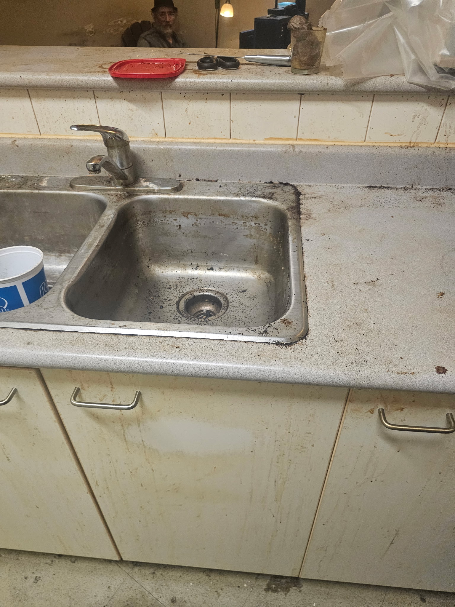 Kitchen sink and counter before deep cleaning in Toronto