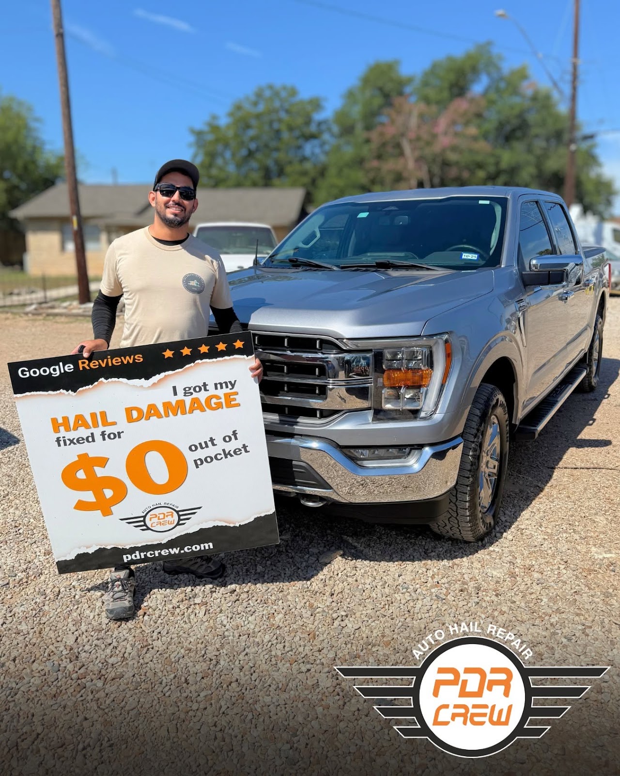 Smiling customer with restored Ford F-150 truck and $0 hail deductible sign
