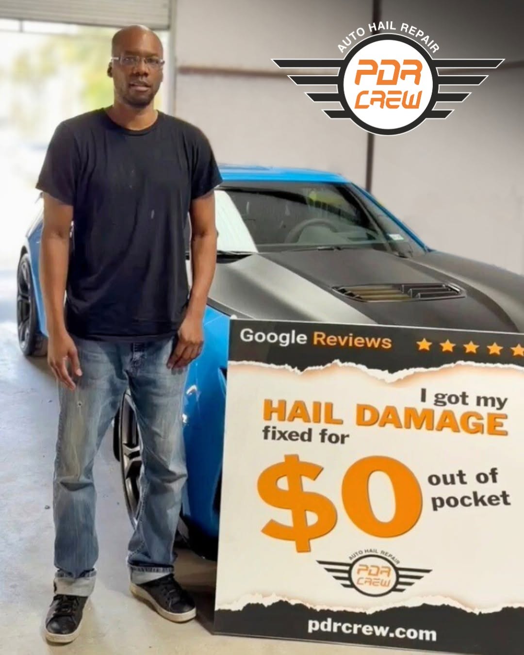 Happy driver standing with repaired vehicle and $0 out of pocket hail damage sign