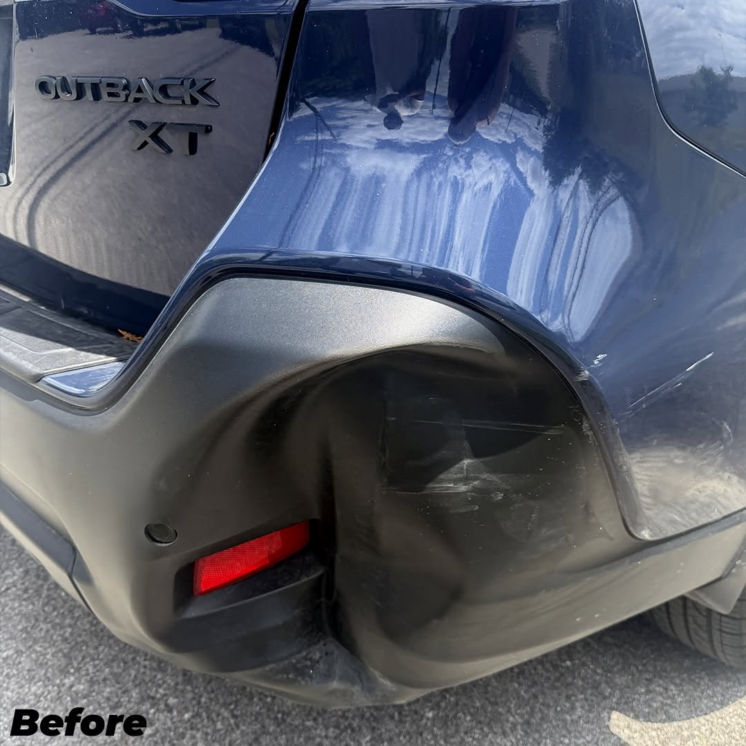 Bumper dent on Subaru Outback awaiting repair