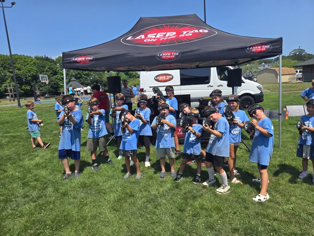 Campers playing mobile laser tag at a Laser Tag On The Go summer camp event