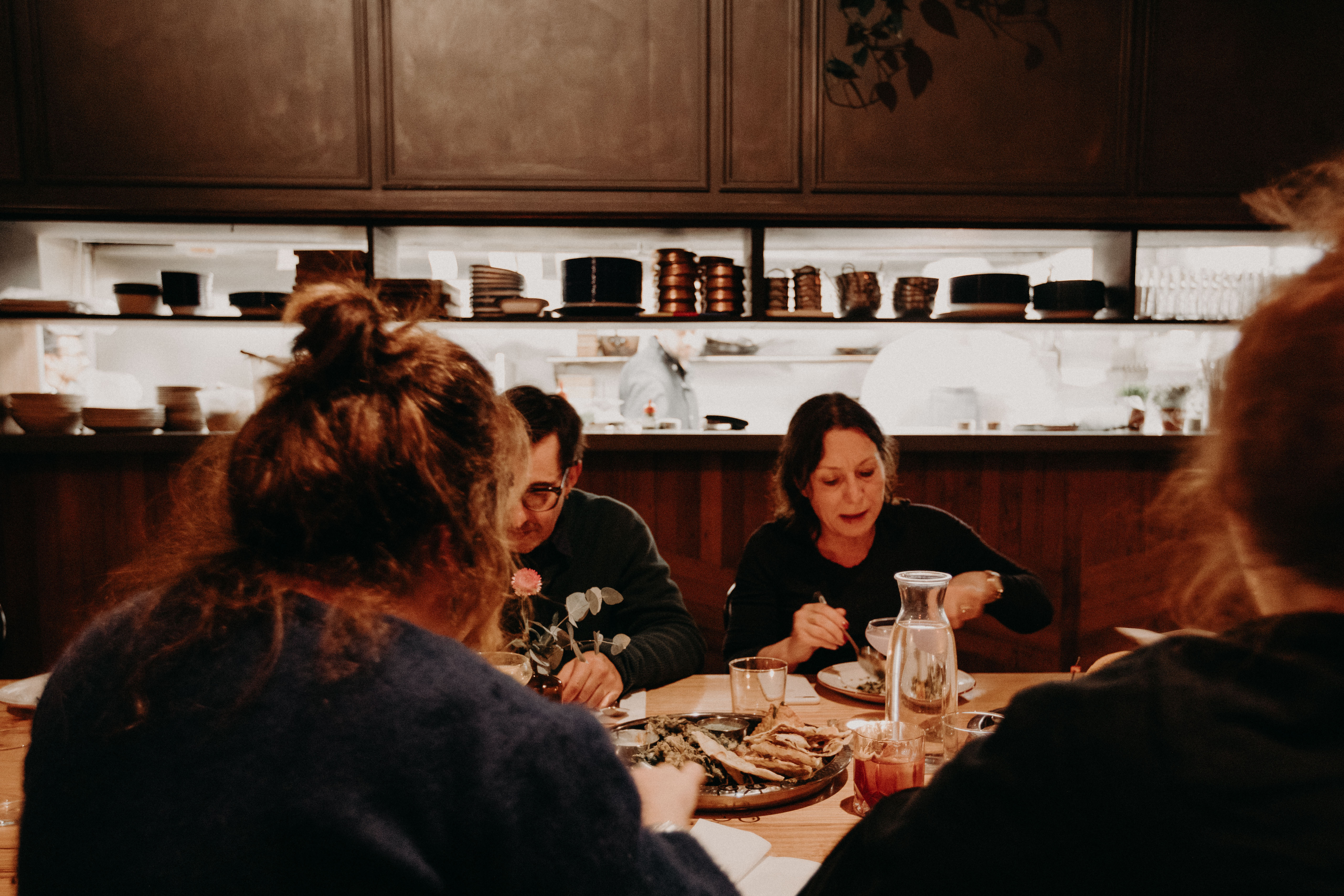 Friends dining and talking at Eat Drink Bhang Brunswick