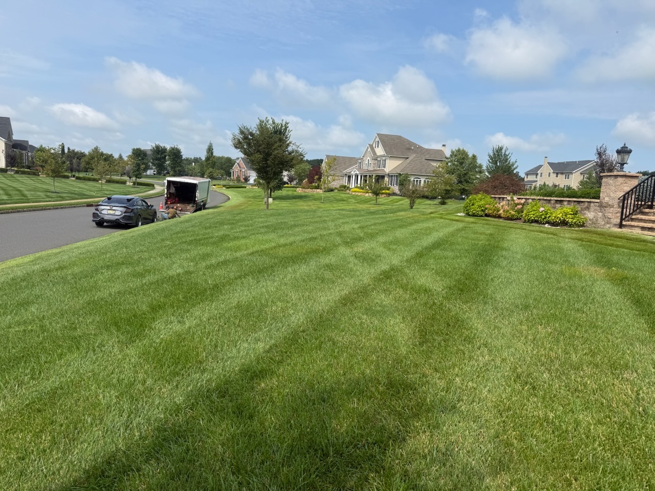 Pristine striped residential lawn and landscape in Princeton NJ