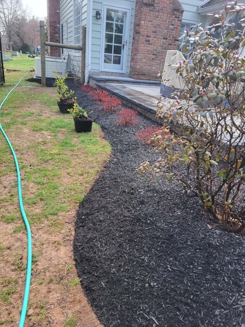 Dark mulch bed installation in Hamilton NJ