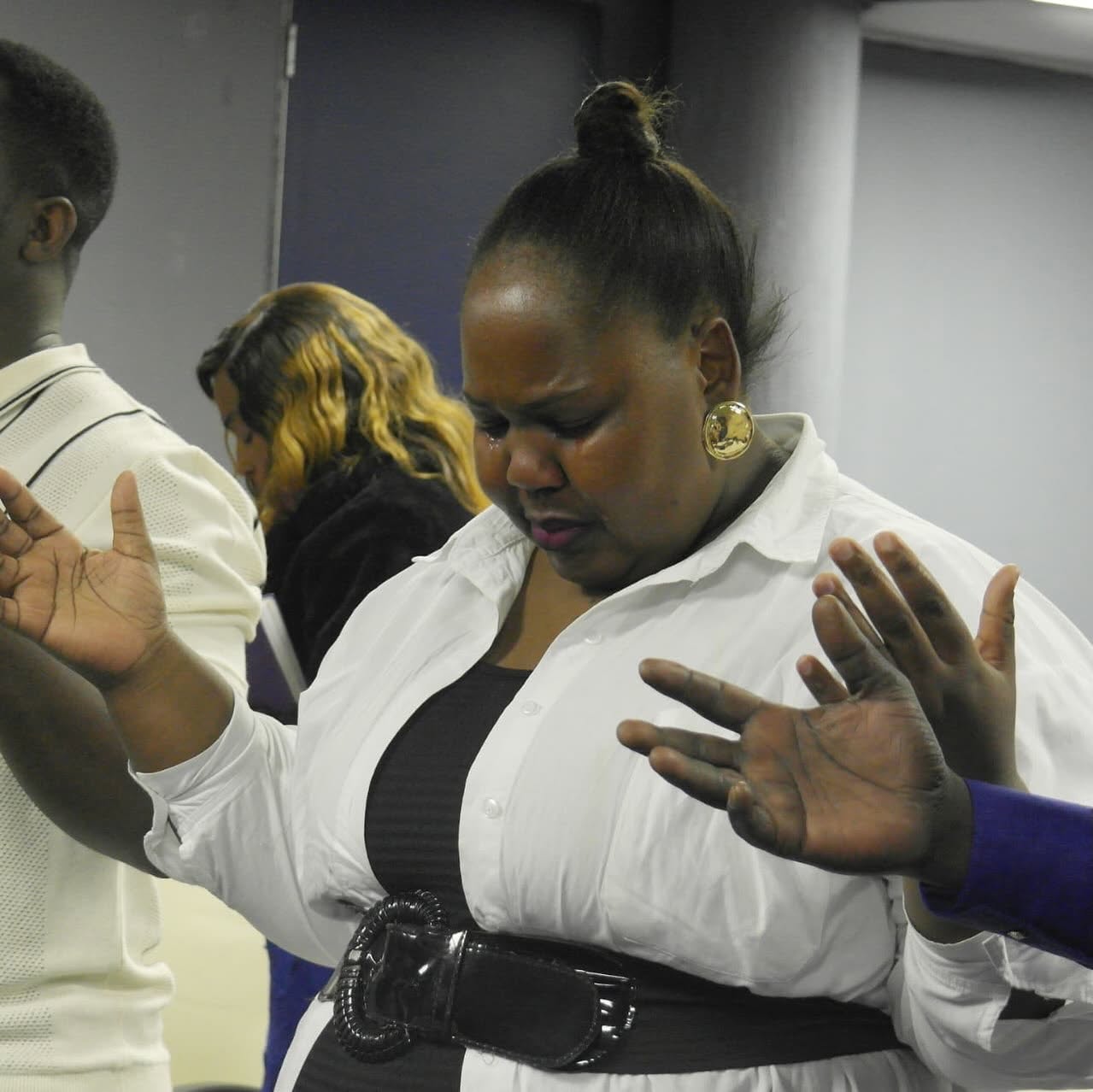 Congregation worshipping and praying during Sunday service