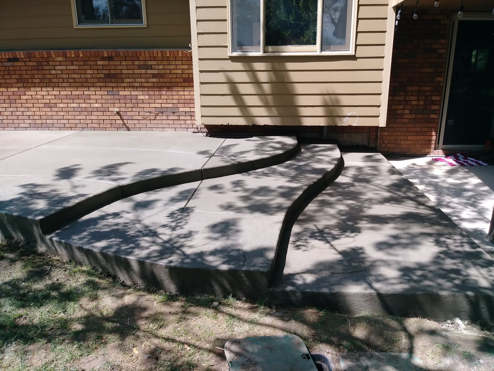 Multi-Tier Curved Concrete Steps and Patio Landing in McKinney TX by Happy's Concrete