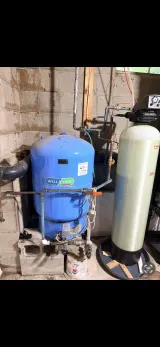 Well pressure tank and water treatment system in a Sussex County basement — Sunrise Pump & Well Water Service