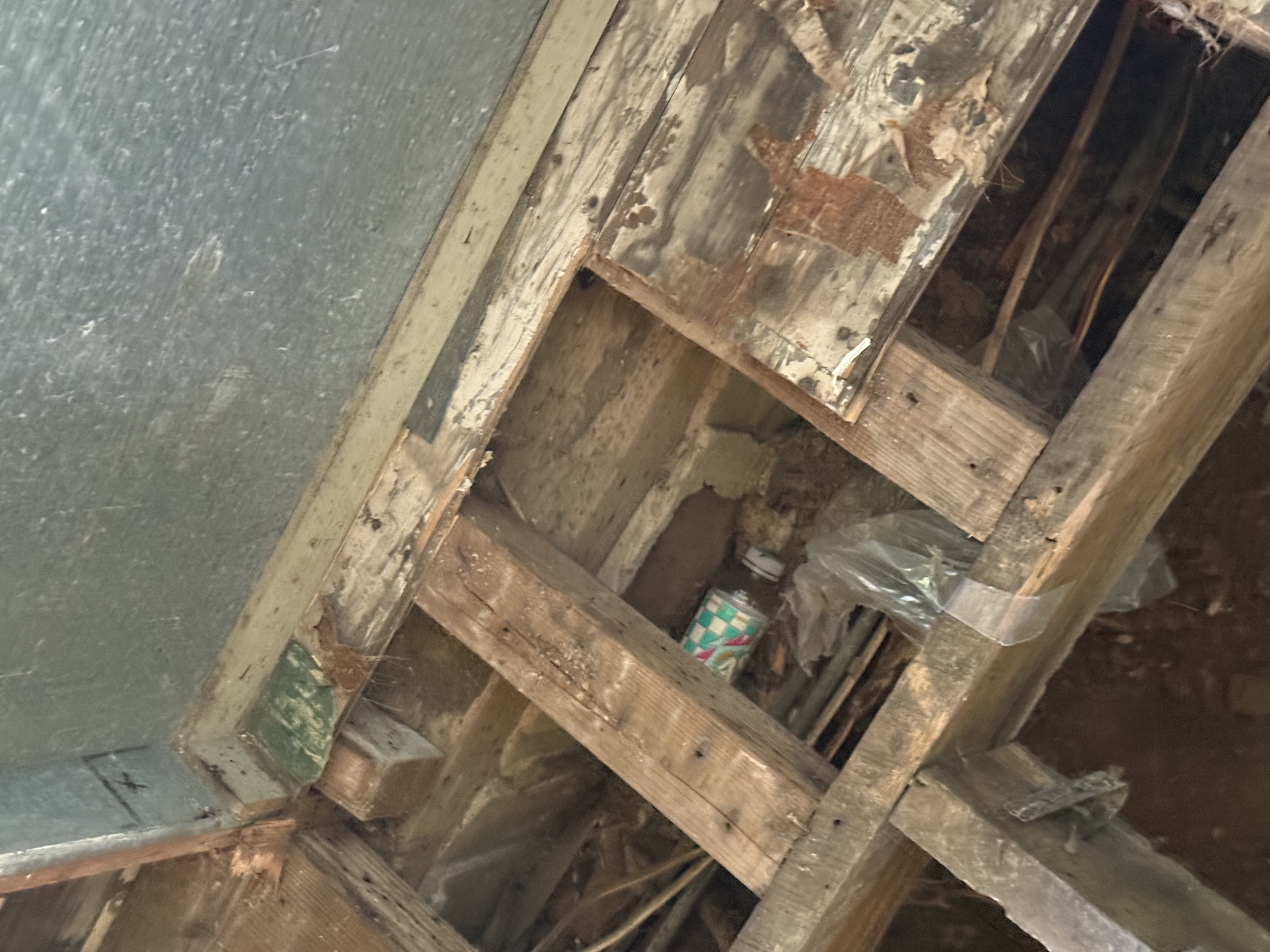Open below-grade well pit beside a home before the casing was raised — Sunrise Pump & Well Water Service