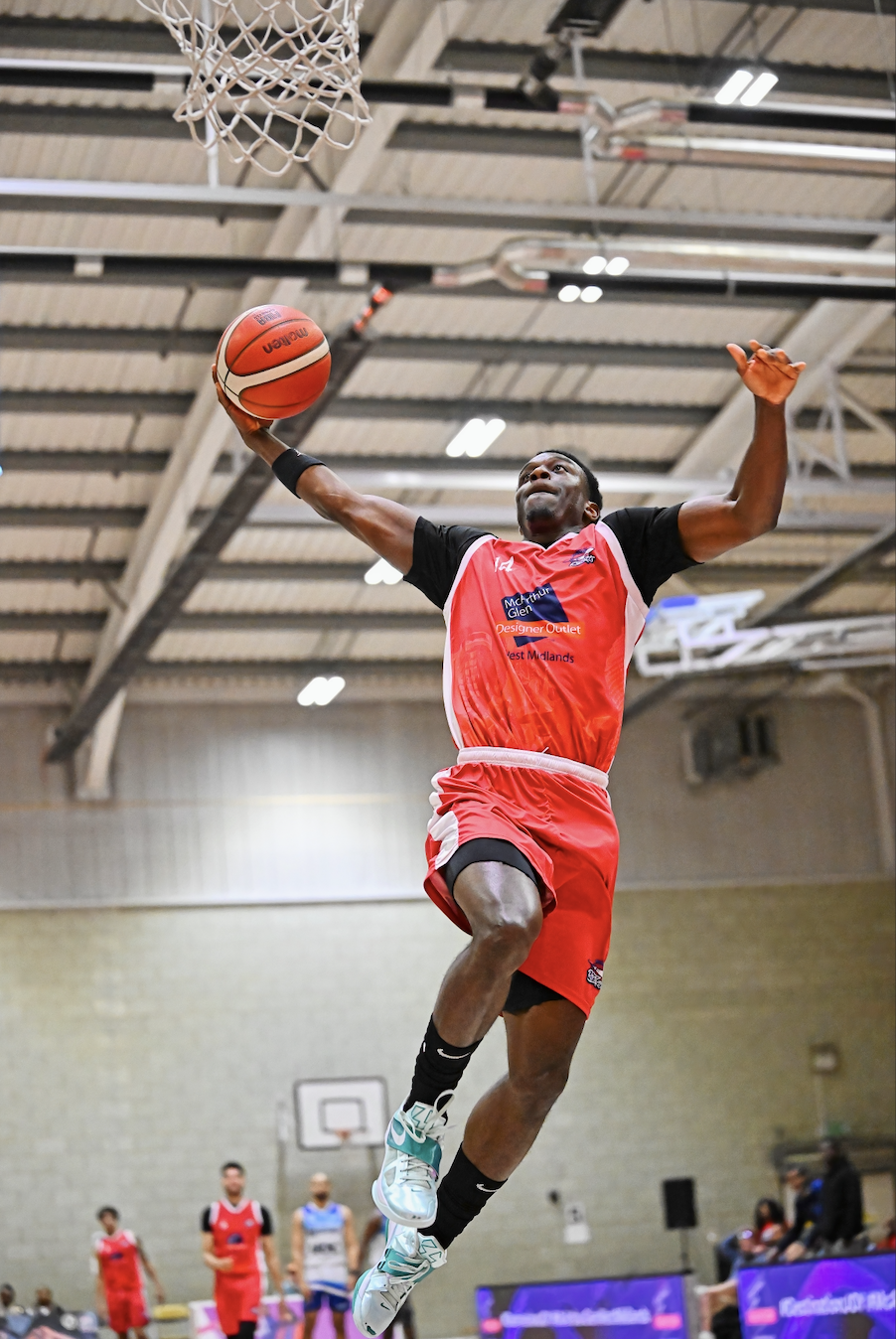 City of Birmingham Rockets player in slam dunk action
