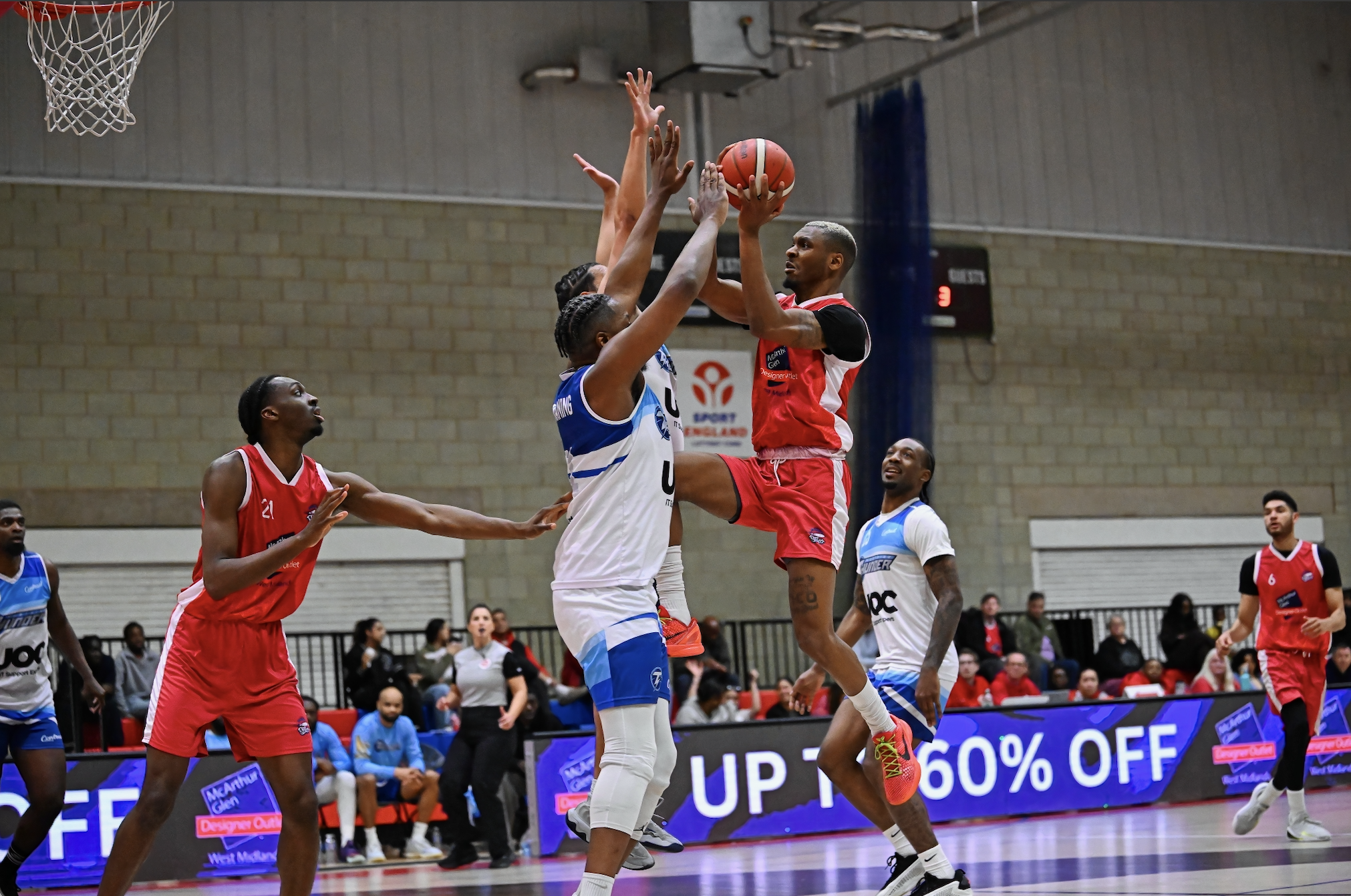 City of Birmingham Rockets intense match contest under the basket