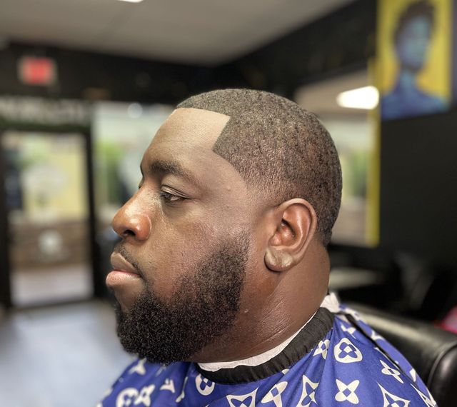 Taper fade with clean beard line-up by The Grooming Gallery