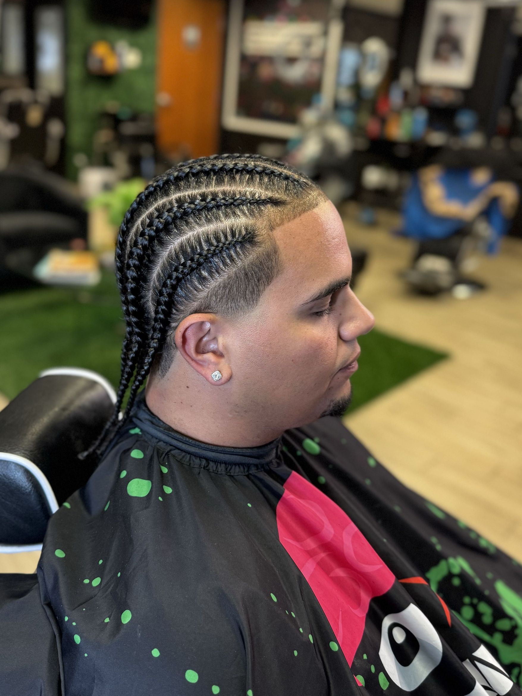 Clean braids and crisp line-up by The Grooming Gallery