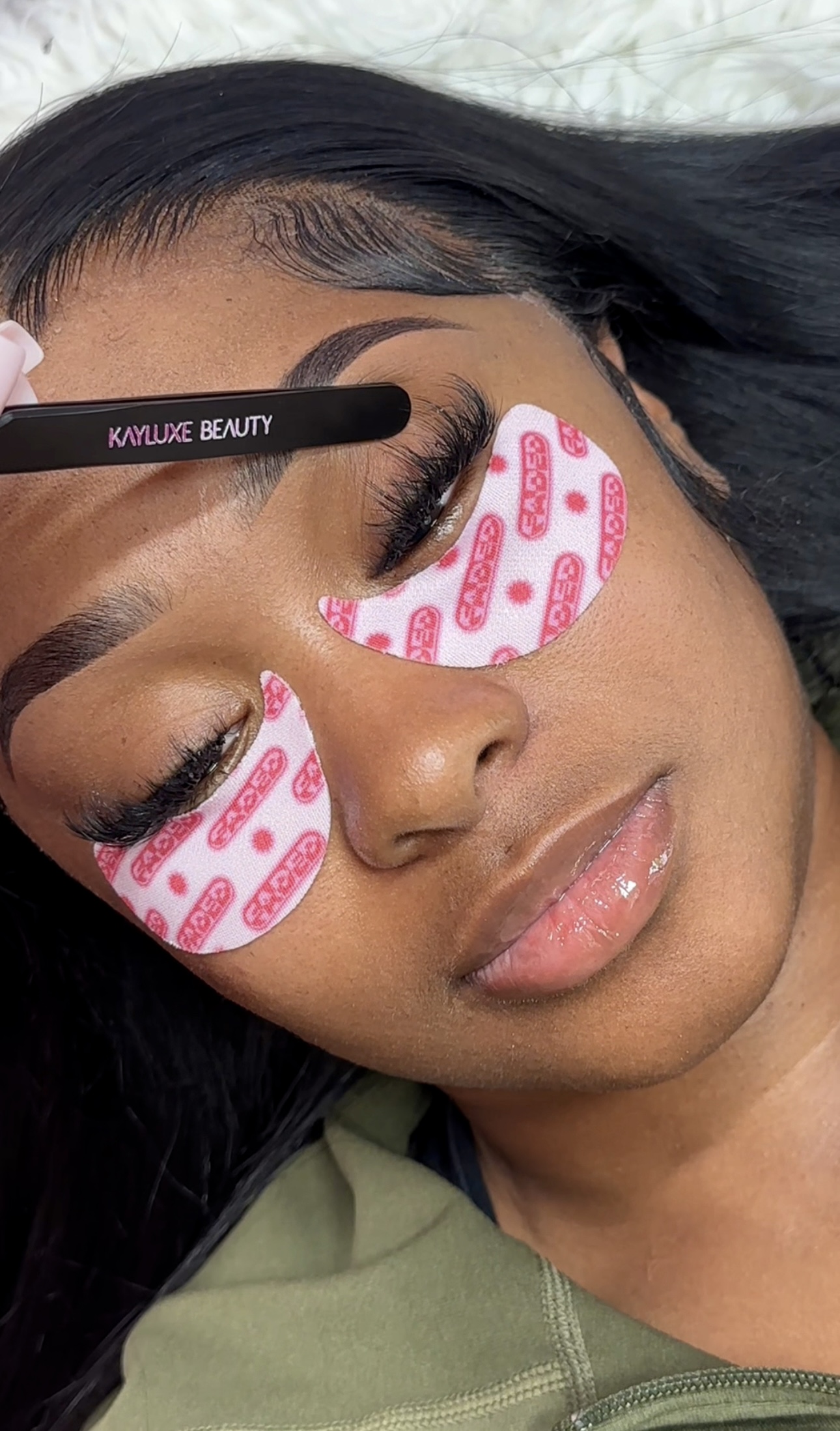 Kayluxe Beauty branded precision tweezers and professional eye patches