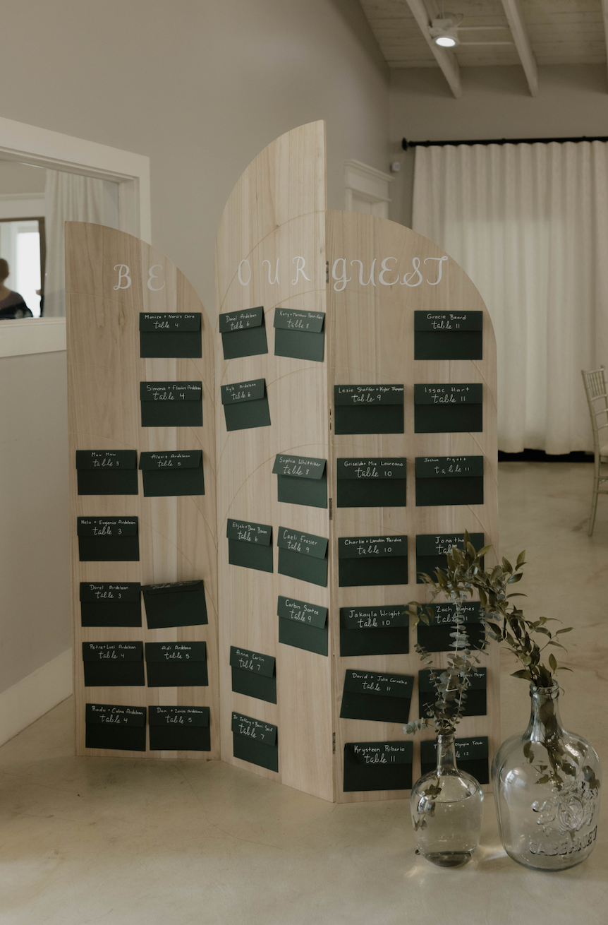 'Be Our Guest' Arched Wooden Seating Chart & Greenery Vases