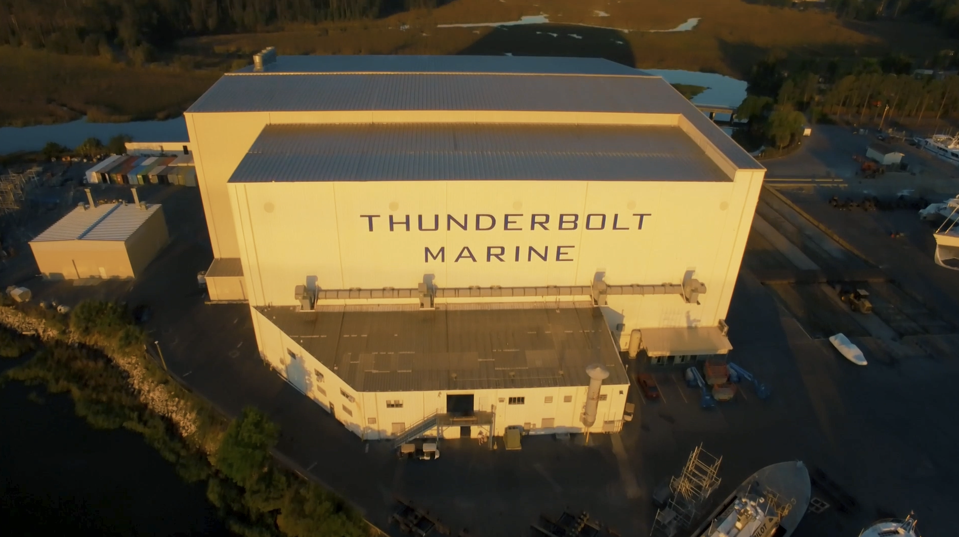 Climate-Controlled Paint Shed Bay Aerial at Sunset