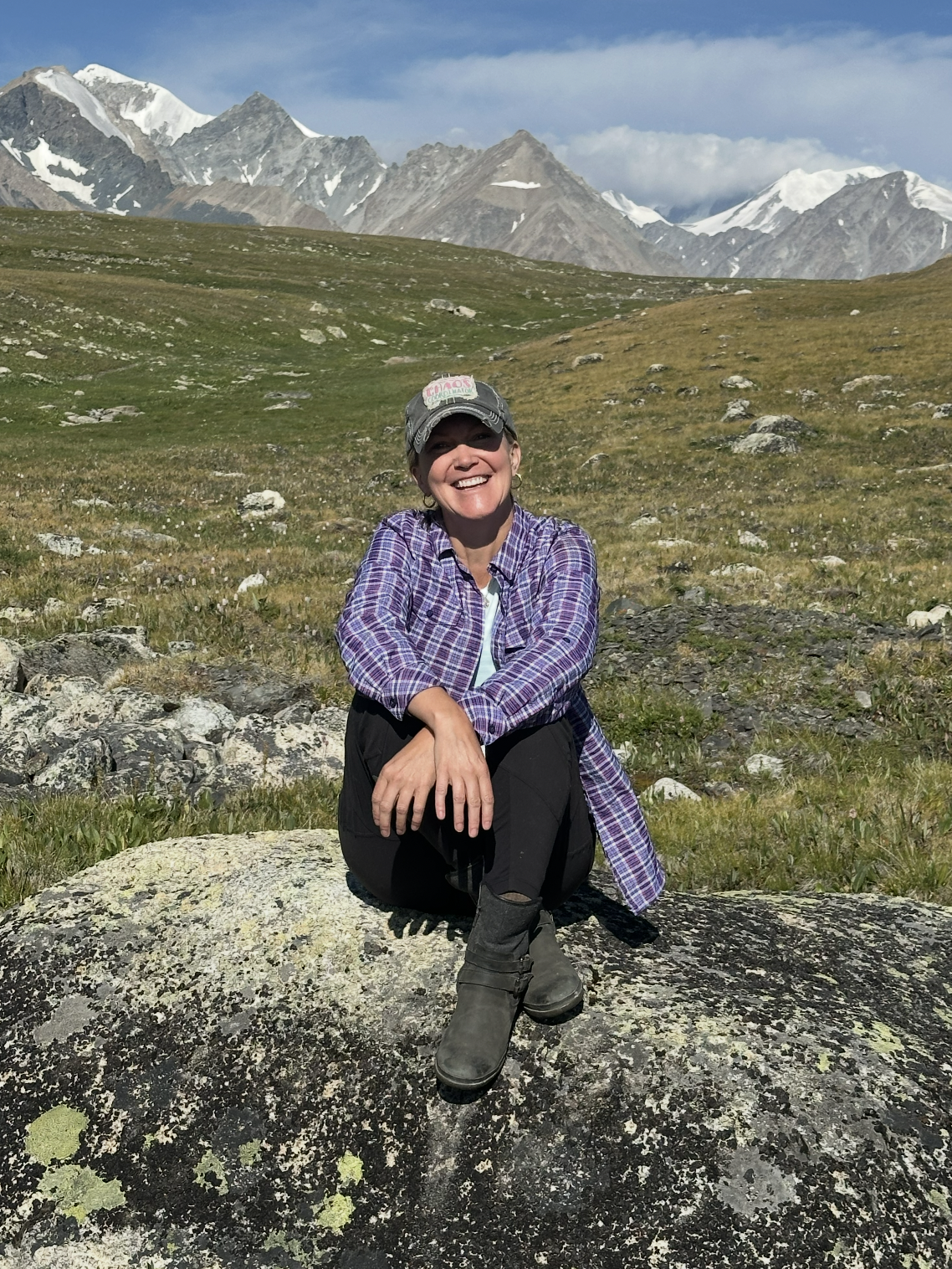 Emily, founder of Wander Women, smiling on a mountain adventure