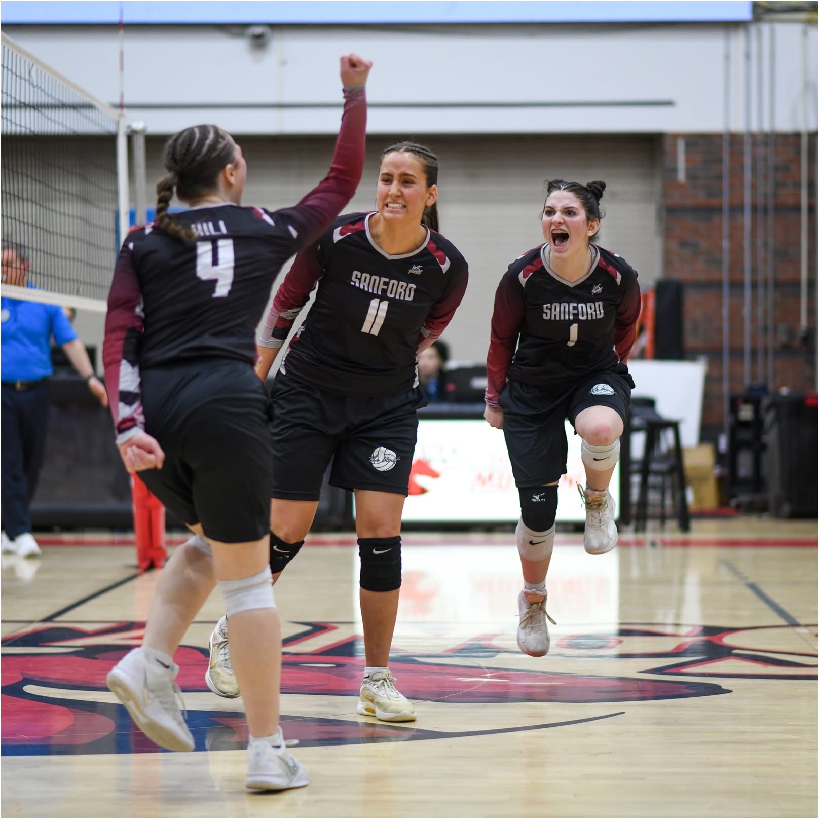 SCA Volleyball Players Celebrating on Court
