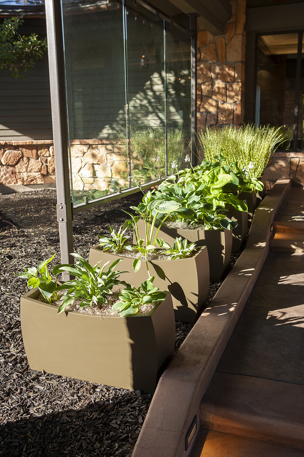 Composition 42 — Exterior plantscaping installation by Rikka Floral