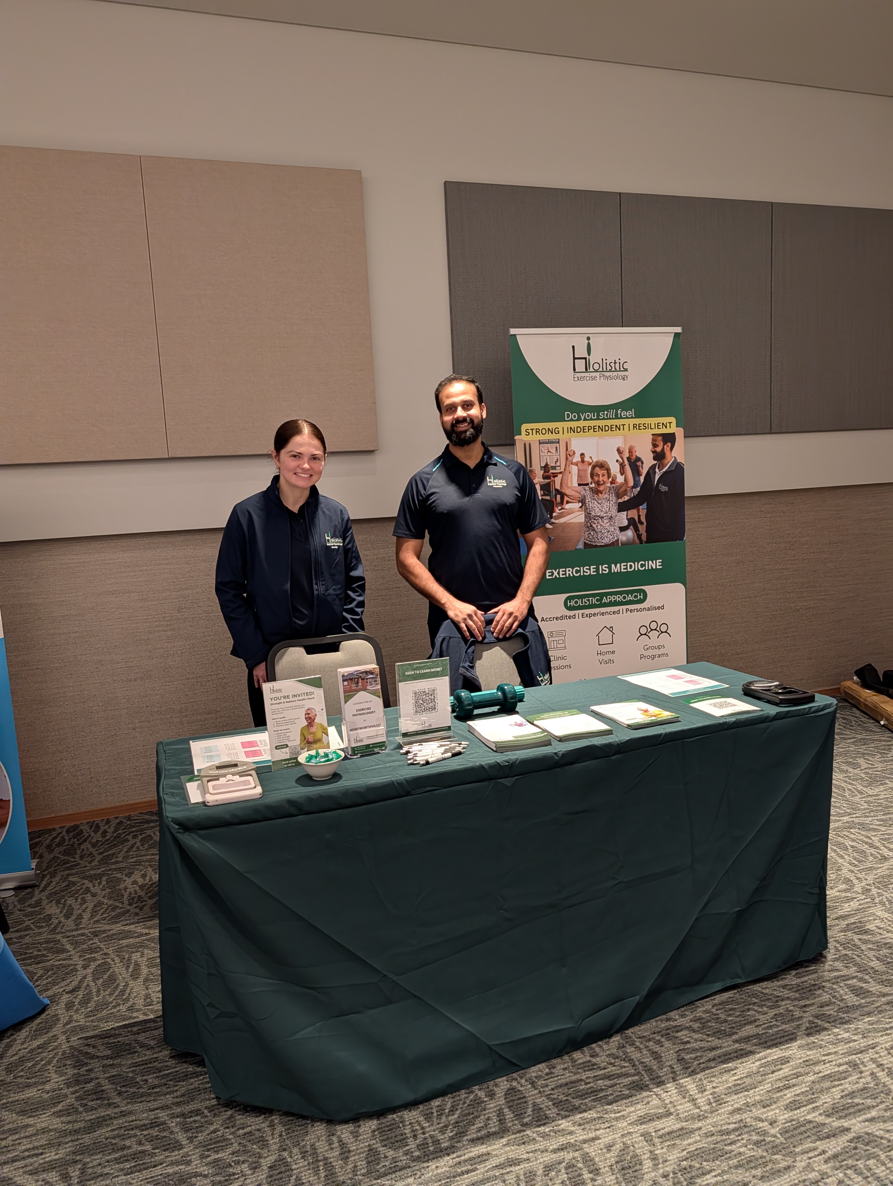 Gabrielle Bingham and Hassan Qureshi representing Holistic Exercise Physiology at a community health event
