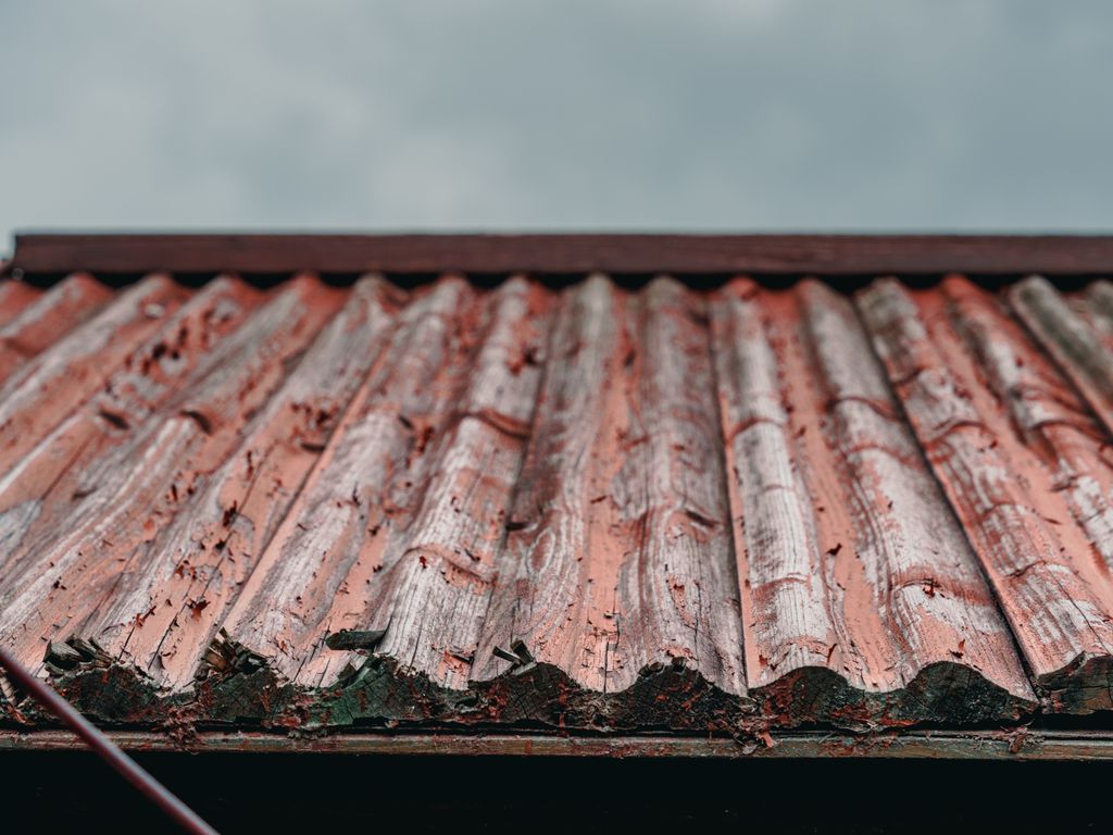 Corrugated metal roof panels seen from below